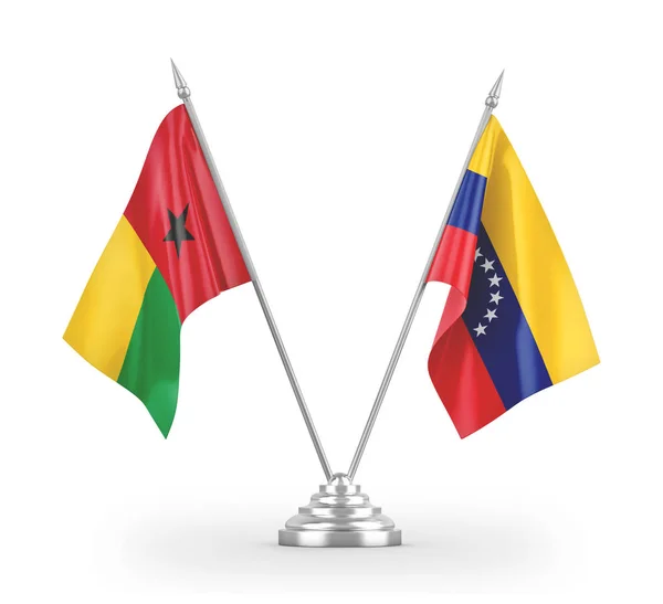 Επιτραπέζιες σημαίες της Βενεζουέλας και της Γουινέας-Μπισάου απομονωμένες σε λευκό 3d — Φωτογραφία Αρχείου