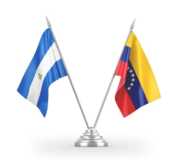 Venezuela and Nicaragua table flags isolated on white 3D rendering — Stock Photo, Image