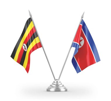 North Korea and Uganda table flags isolated on white 3D rendering