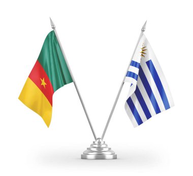Beyaz arkaplan üzerinde izole edilmiş Uruguay ve Kamerun masa bayrakları 3d 