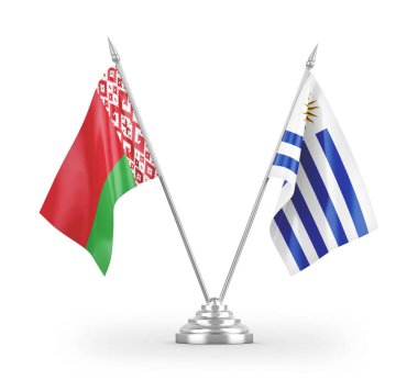 Beyaz arkaplan üzerinde izole edilmiş Uruguay ve Belarus masa bayrakları 3d