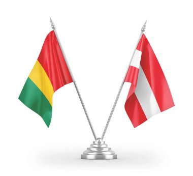 Avusturya ve Gine masa bayrakları beyaz arkaplanda izole edilmiş 3D görüntüleme