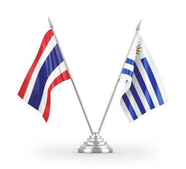 Beyaz arkaplanda izole edilmiş Uruguay ve Tayland masa bayrakları 3D görüntüleme