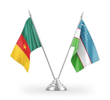 Özbekistan ve Kamerun masa bayrakları beyaz arkaplan 3d görüntüleme üzerinde izole edildi 