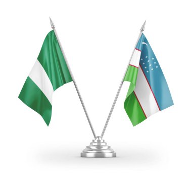 Özbekistan ve Nijerya masa bayrakları beyaz arkaplanda izole edilmiş 3d görüntüleme