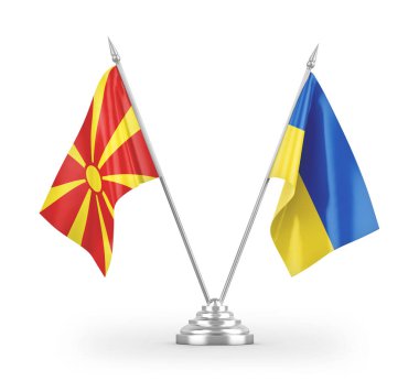 Ukrayna ve Kuzey Makedonya 'da masa bayrakları beyaz zemin üzerinde izole edilmiş 3D görüntüleme