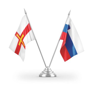 Slovenya ve Guernsey masa bayrakları beyaz arkaplanda izole edilmiş 3d görüntüleme