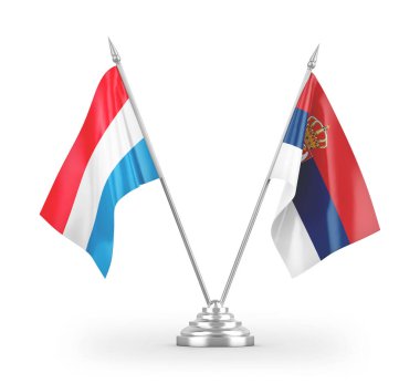 Sırbistan ve Lüksemburg masa bayrakları beyaz arkaplandaki 3D görüntülere izole edilmiş