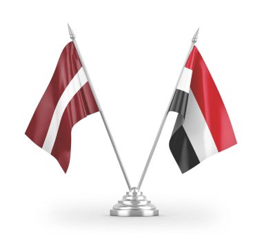 Beyaz arkaplandaki Yemen ve Letonya masa bayrakları 3 boyutlu görüntüleme