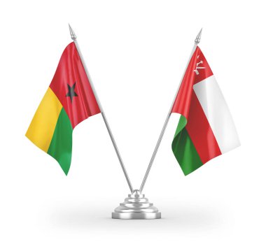Umman ve Gine-Bissau masa bayrakları beyaz arkaplanda izole edilmiş 3D görüntüleme