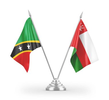 Umman ve Saint Kitts ve Nevis masa bayrakları beyaz arka planda izole edilmiş 3D görüntüleme