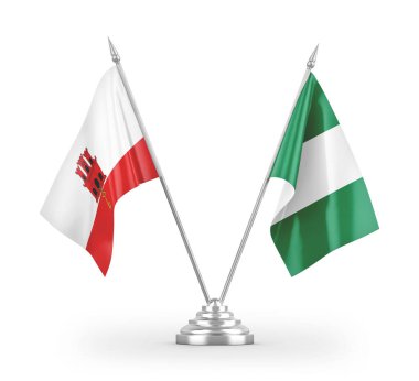 Nijerya ve Gibraltar masa bayrakları beyaz arka planda izole edilmiş 3D görüntüleme