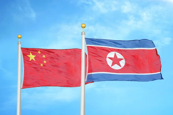 China North Korea Two Flags Flagpoles Blue Cloudy Sky Background — Stock Photo, Image