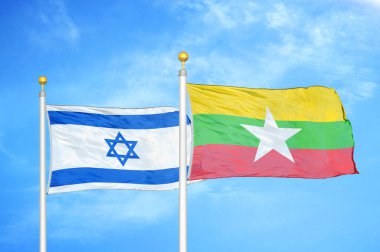 İsrail ve Myanmar bayrak direkleri ve mavi bulutlu arka planda iki bayrak