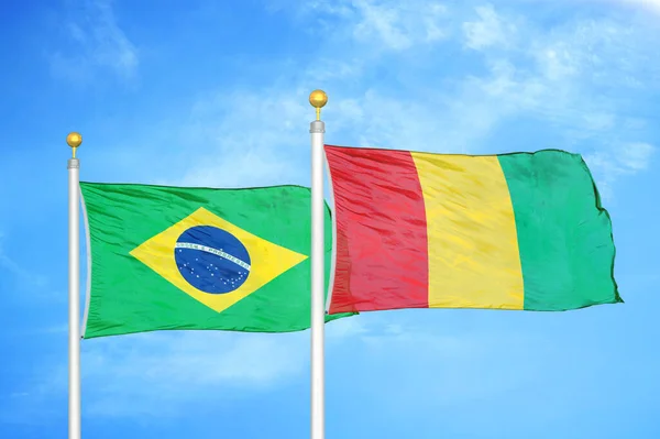 Brazil Guinea Two Flags Flagpoles Blue Cloudy Sky Background — Stock Photo, Image