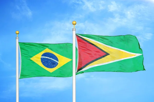 Brazil Guyana Two Flags Flagpoles Blue Cloudy Sky Background — Stock Photo, Image