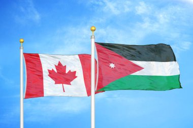 Kanada ve Ürdün bayrak direkleri üzerinde iki bayrak ve mavi bulutlu arka plan