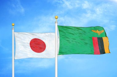 Japonya ve Zambiya bayrak direkleri üzerinde iki bayrak ve mavi bulutlu arka plan