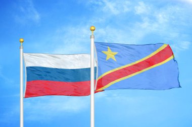 Rusya ve Kongo Demokratik Cumhuriyeti bayrak direkleri ve mavi bulutlu arka planda iki bayrak