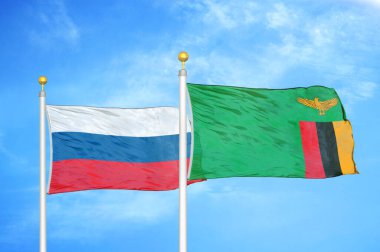 Rusya ve Zambiya bayrak direkleri üzerinde iki bayrak ve mavi bulutlu arka plan