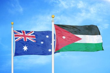 Avustralya ve Ürdün bayrak direkleri üzerinde iki bayrak ve mavi bulutlu arka plan