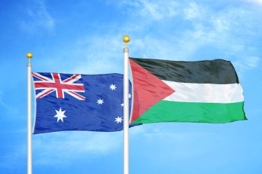 Avustralya ve Filistin bayrak direkleri ve mavi bulutlu arka planda iki bayrak