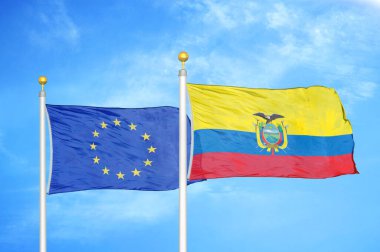 Avrupa Birliği ve Ekvador bayrak direkleri üzerinde iki bayrak ve mavi bulutlu gökyüzü arkaplanı