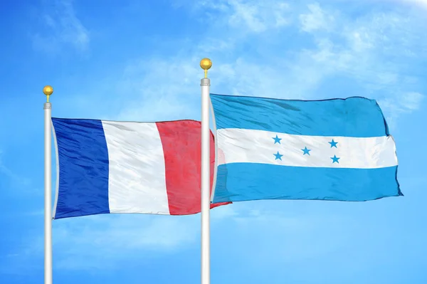 France Honduras Two Flags Flagpoles Blue Cloudy Sky Background — Stock Photo, Image