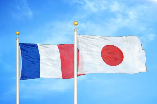 France Japan Two Flags Flagpoles Blue Cloudy Sky Background — Stock Photo, Image
