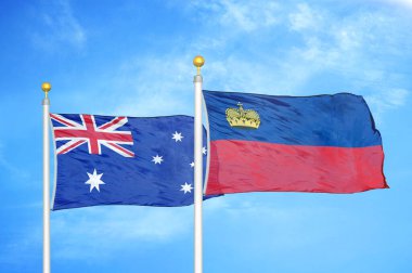 Avustralya ve Lihtenştayn bayrak direkleri ve mavi bulutlu arka planda iki bayrak