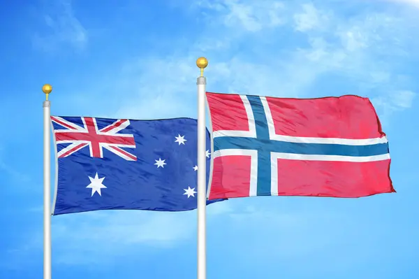 Австралія Норвегія Два Прапори Флагштоках Синє Хмарне Небо — стокове фото