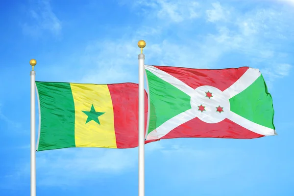 Sénégal Burundi Deux Drapeaux Sur Mâts Fond Bleu Ciel Nuageux — Photo