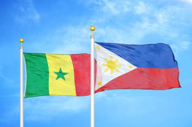 Senegal ve Filipinler bayrak direkleri ve mavi bulutlu arka planda iki bayrak