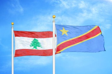 Lübnan ve Kongo Demokratik Cumhuriyeti bayrak direkleri ve mavi bulutlu arka planda iki bayrak