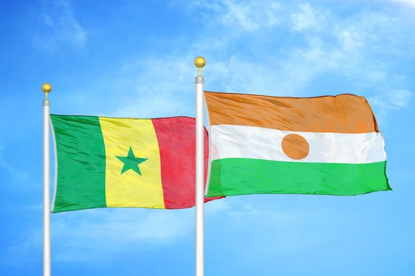Senegal Niger Two Flags Flagpoles Blue Cloudy Sky Background — Stock Photo, Image