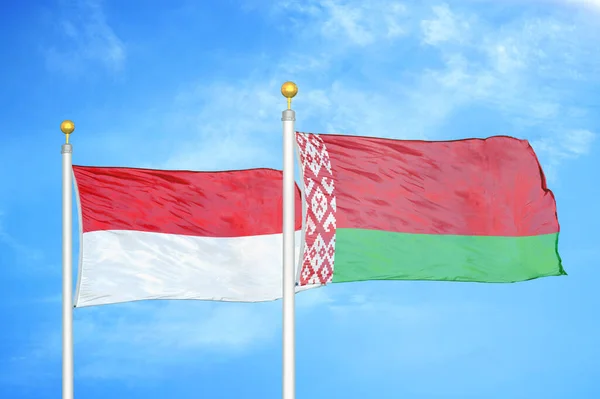 Indonesia Belarus Two Flags Flagpoles Blue Cloudy Sky Background — Stock Photo, Image