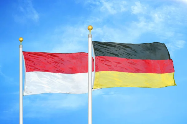 Indonesien Och Tyskland Två Flaggor Flaggstänger Och Blå Molnig Himmel — Stockfoto
