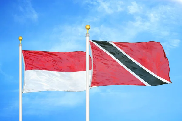 Indonesia Trinidad Tobago Two Flags Flagpoles Blue Cloudy Sky Background — Stock Photo, Image