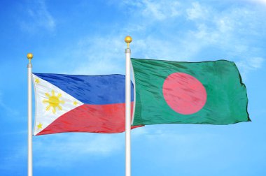 Filipinler ve Bangladeş bayrak direkleri üzerinde iki bayrak ve mavi bulutlu arka plan