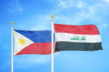 Filipinler ve Irak bayrak direkleri üzerinde iki bayrak ve mavi bulutlu arka plan