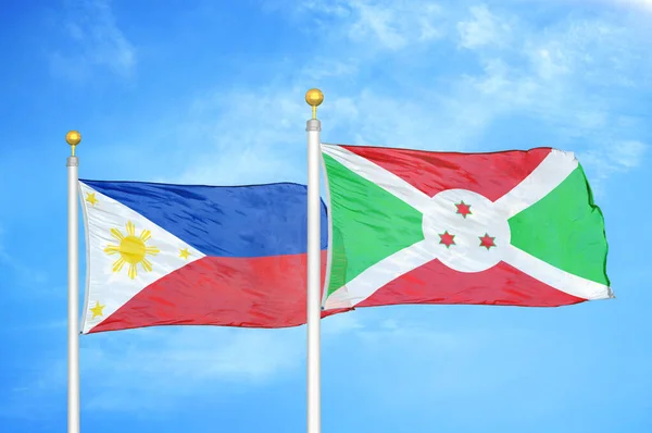 Philippines Burundi Two Flags Flagpoles Blue Cloudy Sky Background — Stock Photo, Image