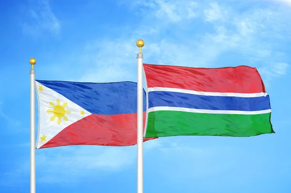 Philippines Gambia Two Flags Flagpoles Blue Cloudy Sky Background — Stock Photo, Image