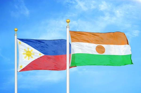 Philippines Niger Two Flags Flagpoles Blue Cloudy Sky Background — Stock Photo, Image