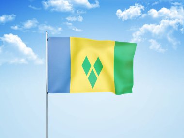 Saint Vincent ve Grenadines bayrağı bulutlu gökyüzünde dalgalanıyor.