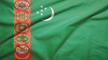 Türkmenistan kumaş dokusunda bayrak sallıyor