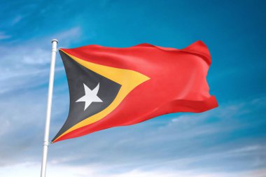 Bulutlu gökyüzünde Doğu Timor bayrağı dalgalanıyor.