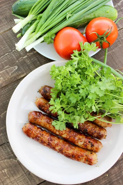Grilled sausages on the coals — Stock Photo, Image