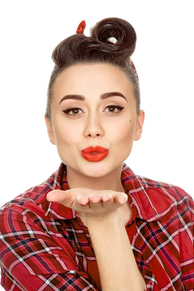 Stunning pinup girl blowing kisses — Stock Photo, Image