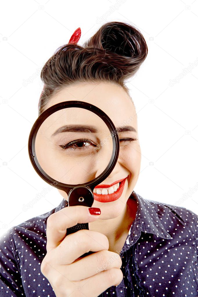 Young pinup girl with magnifying glass