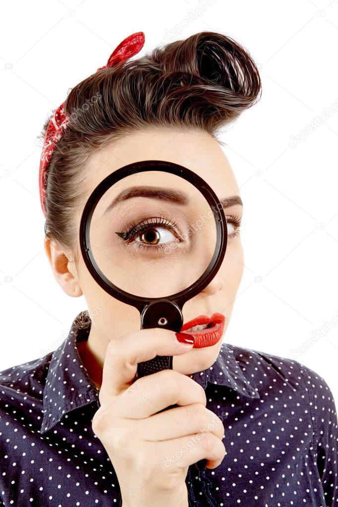 Young pinup girl with magnifying glass